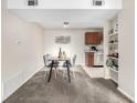 Cozy dining area featuring a table with four chairs and nearby kitchen at 5300 E Cherry Creek South Dr # 324, Denver, CO 80246