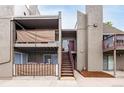 Townhome exterior with two levels and walkways, plus a glimpse of patios on the higher floors at 5300 E Cherry Creek South Dr # 324, Denver, CO 80246