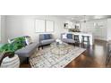 Bright and airy living room with modern decor and an open floor plan, great for entertaining at 475 S Eliot St, Denver, CO 80219