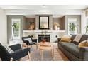 Cozy living room featuring a fireplace, recessed lighting, and comfortable seating arrangement at 9265 Buttonhill Ct, Highlands Ranch, CO 80130