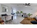 Bright and airy living room featuring modern decor, stylish furnishings, and hardwood floors at 2283 S Bannock St, Denver, CO 80223