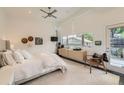 Bright bedroom featuring a ceiling fan, large window, and modern decor at 3850 Vallejo St, Denver, CO 80211