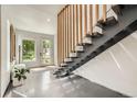 Bright foyer with contemporary staircase and welcoming entryway at 3850 Vallejo St, Denver, CO 80211