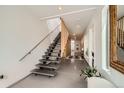 Modern foyer featuring a unique staircase and stylish decor at 3850 Vallejo St, Denver, CO 80211