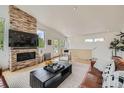Inviting living room with a brick fireplace and entertainment center at 3850 Vallejo St, Denver, CO 80211