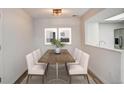 Bright dining area featuring modern decor and comfortable seating for six at 7870 W 87Th Dr # J, Arvada, CO 80005