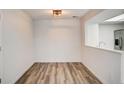 Bright dining space with hard wood floors and a pass through to the kitchen at 7870 W 87Th Dr # J, Arvada, CO 80005