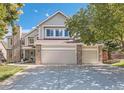 Spacious three-car garage with ample parking space and convenient access to the home's interior at 10032 Astoria Ct, Lone Tree, CO 80124