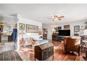 Spacious living room with hardwood floors and bright natural light, adjacent to the kitchen at 860 S 7Th Ave, Brighton, CO 80601