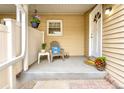 Welcoming front porch with decorative plants, outdoor seating, and stylish entrance at 2650 S Vaughn Way # B, Aurora, CO 80014