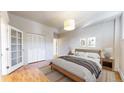 Bedroom with natural light and hardwood floors and closet at 108 W Byers Pl # G4, Denver, CO 80223