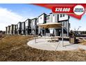 Modern townhomes with open patio and seating area perfect for outdoor entertaining at 2676 W 68Th Ave, Denver, CO 80221