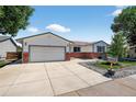 Charming single-story home featuring a large driveway and easy to maintain rock and lawn at 8721 W 86Th Ave, Arvada, CO 80005