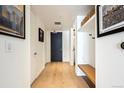 Entryway with hardwood floors, storage, hall closet and a modern design at 1750 Wewatta St # 627, Denver, CO 80202