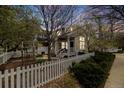 Charming exterior elevation with a white picket fence, garden, and inviting front porch at 2428 Concord Cir, Lafayette, CO 80026