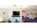 Comfortable living room with plush seating, fireplace, and modern decor for cozy relaxation at 3825 S Monaco Pkwy # 111, Denver, CO 80237