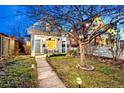 Quaint bungalow with a landscaped front yard and pathway at 4508 W 34Th Ave, Denver, CO 80212