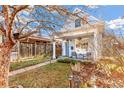 Adorable bungalow showcasing curb appeal with a tree and walkway at 4508 W 34Th Ave, Denver, CO 80212