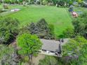 Aerial view highlights the property's large yard, mature trees, and serene setting for a nature-filled lifestyle at 14650 Tejon St, Broomfield, CO 80023