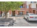 Building entrance with a well maintained yard, parking, and walkway to the front door at 4100 Albion St # 611, Denver, CO 80216
