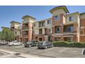 Exterior of a multi-story apartment building featuring brick accents and well-maintained landscaping at 4100 Albion St # 611, Denver, CO 80216