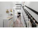 Bright entryway featuring stylish decor, hardwood floors, and staircase leading to the second floor at 1061 S Yampa St # C, Aurora, CO 80017