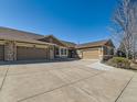 Home with multi-car garages and wide driveway for ample parking at 15217 Xenia St, Thornton, CO 80602