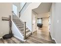 Bright and spacious entryway with stairs, hardwood floors, and an open floor plan at 9880 E 160Th Pl, Brighton, CO 80602