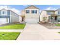 Attractive two-story home featuring a two-car garage, neat landscaping, and a welcoming entrance at 1638 Plata St, Lochbuie, CO 80603