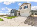 Beautiful two-story home with a spacious driveway, complemented by a neat lawn and landscaping at 1638 Plata St, Lochbuie, CO 80603