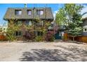 Multi-story brick building with mature trees, ample parking, and inviting entryway at 70 N Grant St # 10, Denver, CO 80203