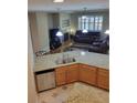 Kitchen island with granite countertops and stainless steel appliances at 13349 Krameria St, Thornton, CO 80602