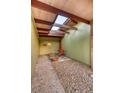 Secluded patio with a skylight, brick accents, and outdoor seating for a tranquil and private space at 5450 Mohawk Rd, Littleton, CO 80123
