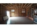 Spacious living room in the framing stage showcasing the layout and construction at 3091 S Holly Pl, Denver, CO 80222