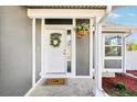 Charming entrance featuring a decorative wreath and floral arrangement at 1292 W 133Rd Cir, Westminster, CO 80234