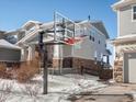 Basketball hoop in front of a two story house with gray siding at 27750 E Lakeview Dr, Aurora, CO 80016