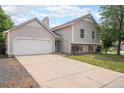 Attractive exterior view of a two-story home with a spacious driveway and attached garage at 12632 James Ct, Broomfield, CO 80020