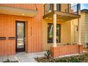 Inviting front door to the home, featuring brick accents and a small covered porch, plus the house number at 3122 Perry St, Denver, CO 80212