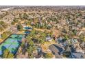 Aerial view showcasing home location near community pool, tennis courts, and green spaces at 3269 W 101St Cir, Westminster, CO 80031