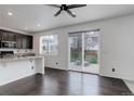 Kitchen area leading to an outdoor deck, offering seamless indoor-outdoor living at 9250 Rifle St, Commerce City, CO 80022