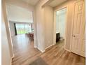 Inviting hallway view showcasing an open layout into the living area and a convenient half-bath at 3029 Merlin Dr, Brighton, CO 80601