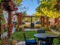 Secluded backyard features a pergola-covered dining area, perfect for outdoor entertaining at 8985 E 29Th Pl, Denver, CO 80238