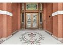 Elegant entryway with ornate tile flooring and intricate glasswork above the door at 836 E 17Th Ave # 1A, Denver, CO 80218