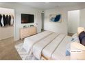 Spacious bedroom with large bed, dresser, and walk-in closet at 8019 Wolff St # H, Westminster, CO 80031