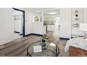 Open concept living space with modern flooring, stylish decor, and an inviting atmosphere at 4842 Steele St, Denver, CO 80216