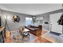 Cozy living room showcasing a brown sofa and an area rug, perfect for a relaxing atmosphere at 7973 Chase Cir # 56, Arvada, CO 80003