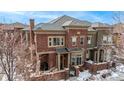 Stunning brick home with a well-manicured lawn and charming curb appeal at 9461 Elmhurst Ln # C, Highlands Ranch, CO 80129