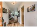 Bright entryway with wood floors and modern decor leading to a view of the living area at 3632 N Pecos St, Denver, CO 80211