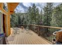 Relaxing outdoor deck with seating, ideal for enjoying nature and outdoor meals at 1353 Elk Valley Dr, Evergreen, CO 80439