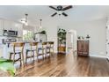 Bright living area flows into a modern kitchen, perfect for entertaining at 1171 Syracuse St, Denver, CO 80220